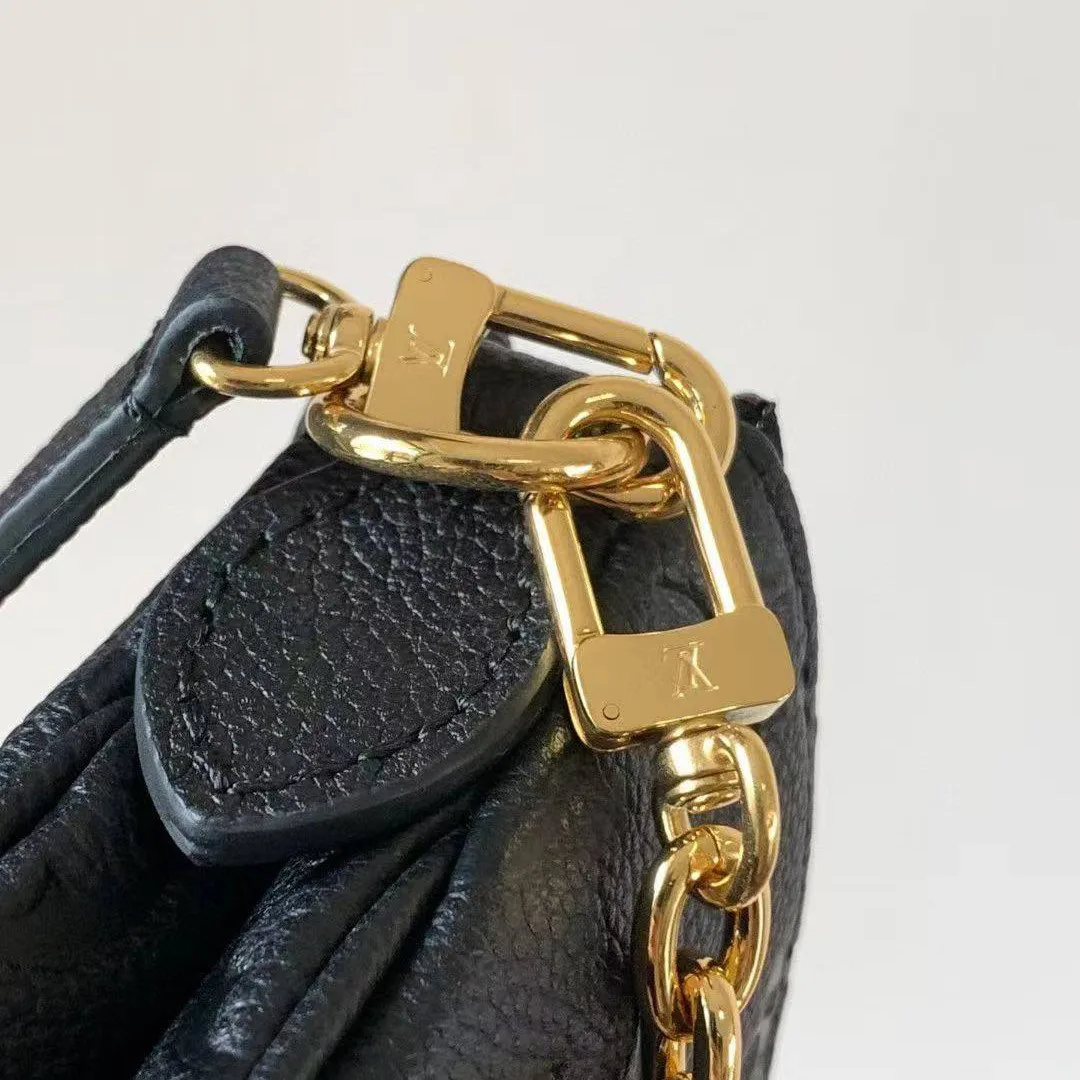 M83301 Pochette Liv Bag Monogram Empreinte Leather Handbag