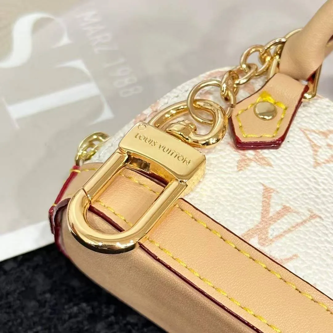 M01883 Micro Alma Bag Charm Monogram Dune Coated Canvas