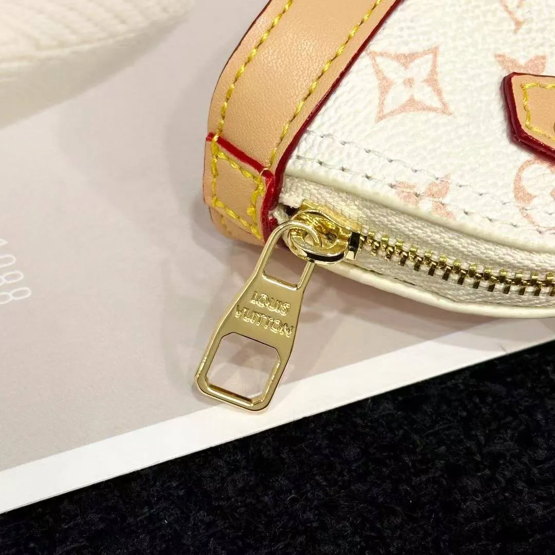 M01883 Micro Alma Bag Charm Monogram Dune Coated Canvas