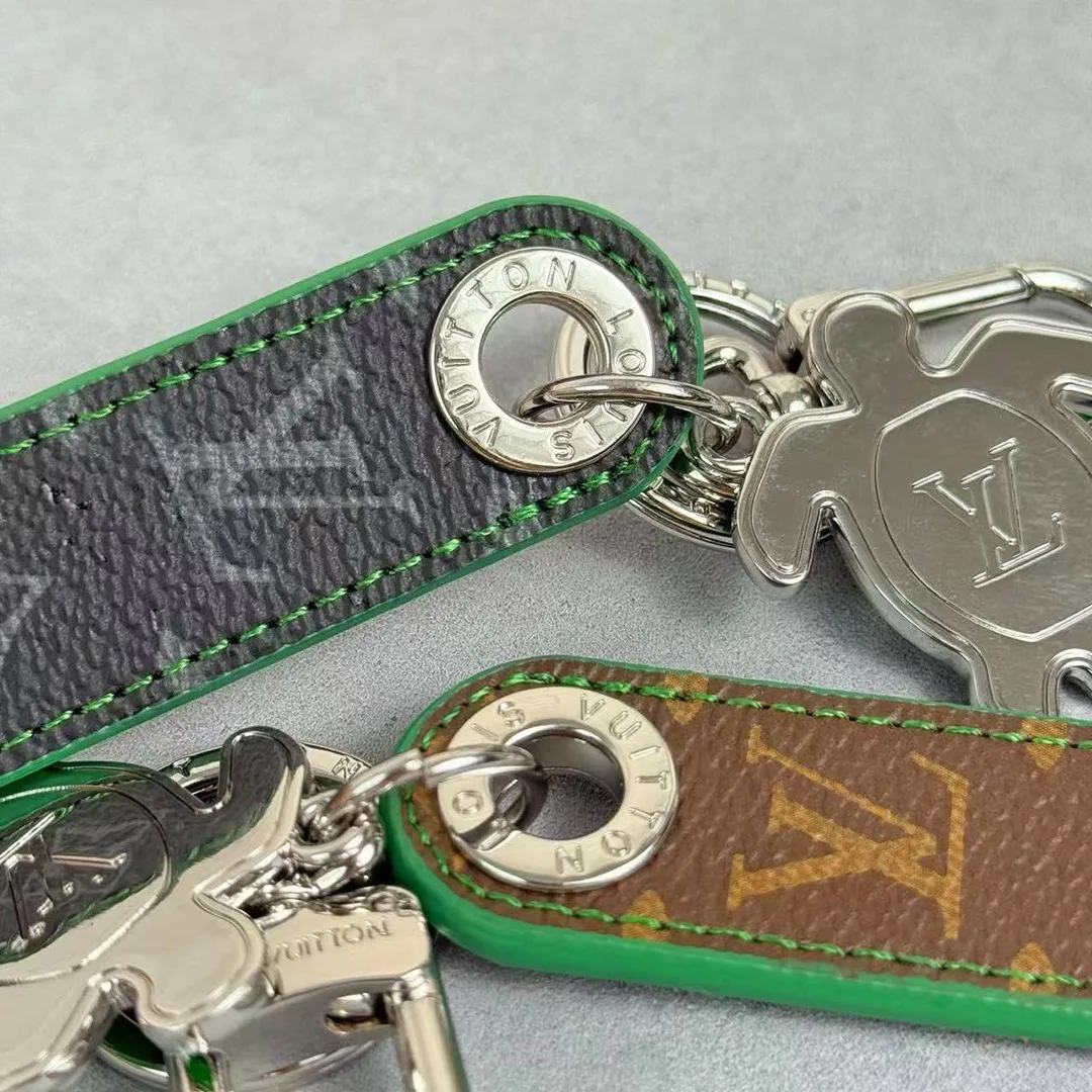 M02564 Dragonne Tab Key Holder and Bag Charm Monogram