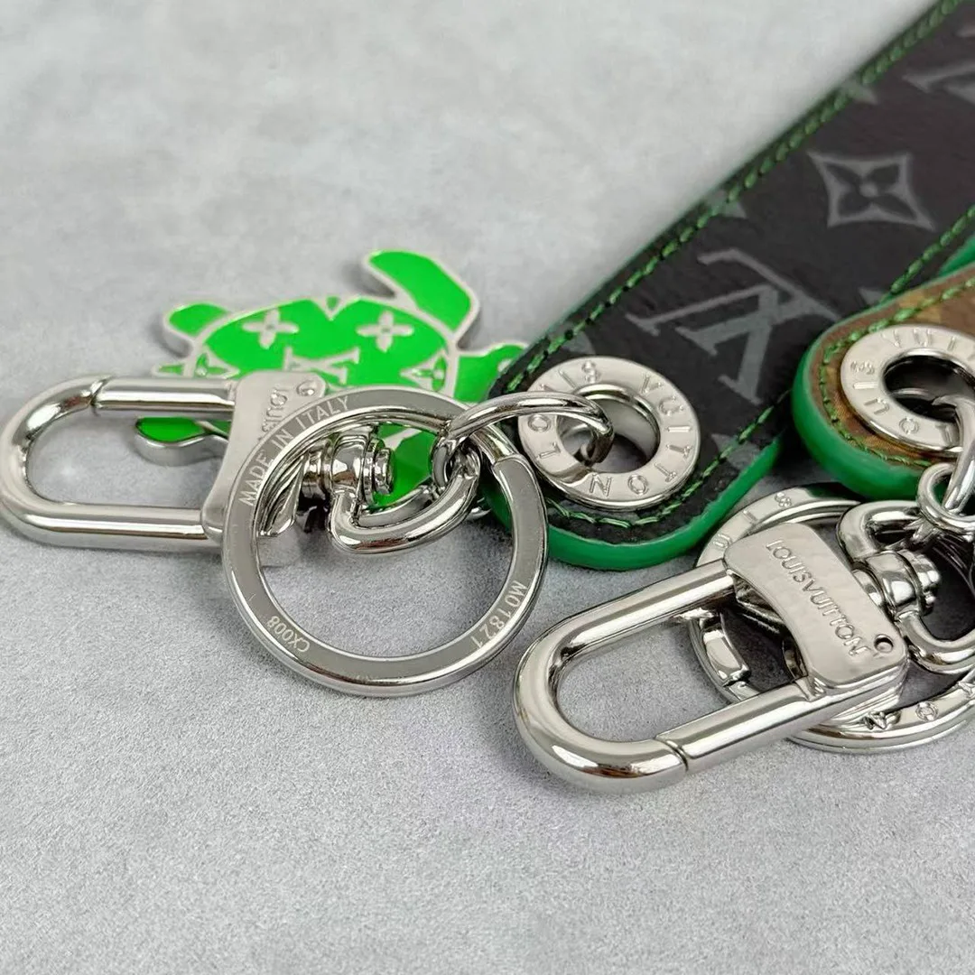 M02564 Dragonne Tab Key Holder and Bag Charm Monogram