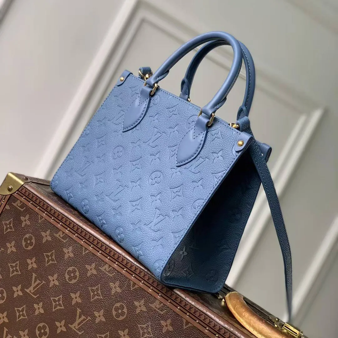 M28181 OnTheGo PM Monogram Empreinte Leather Handbag