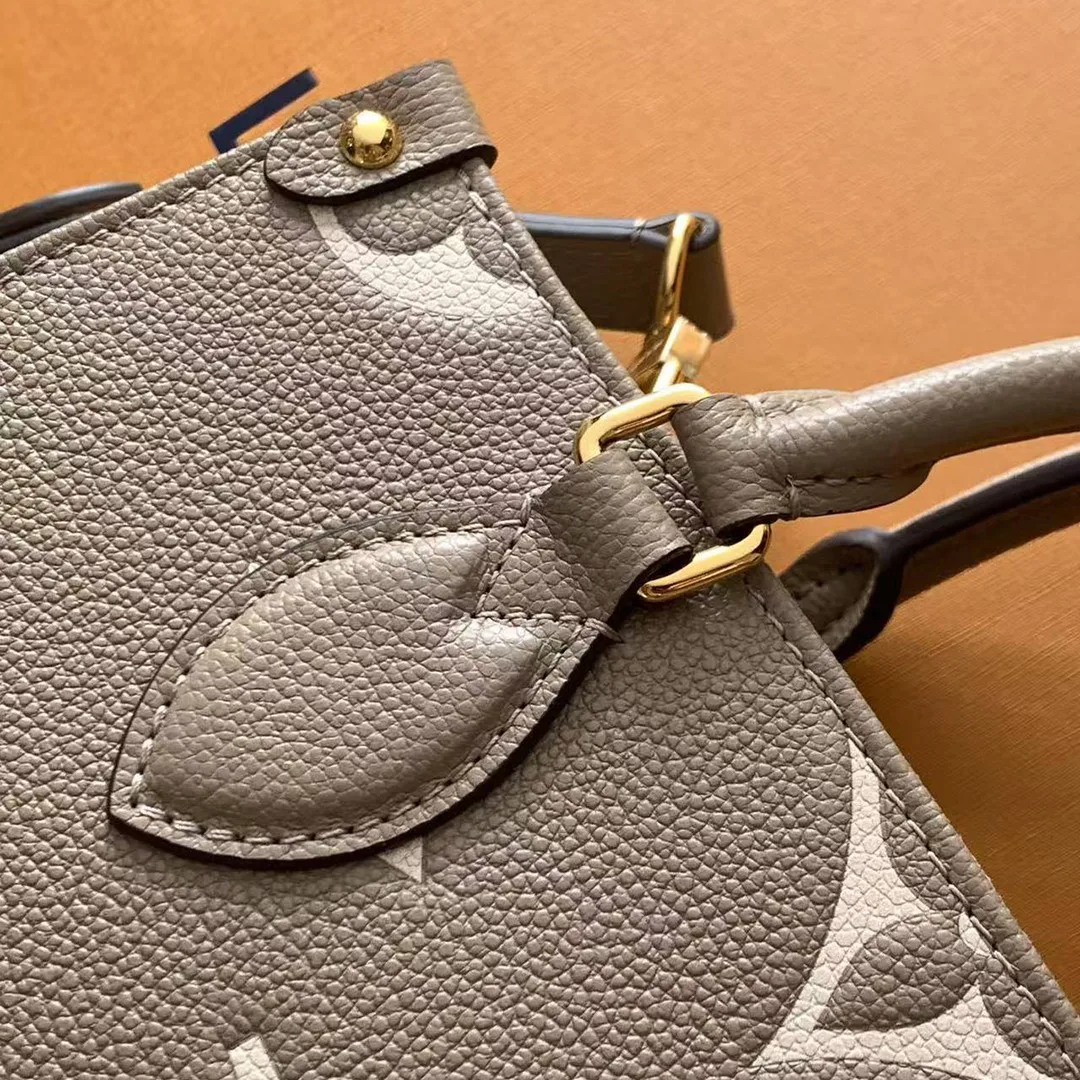 M45779 OnTheGo PM Bicolor Monogram Empreinte Leather
