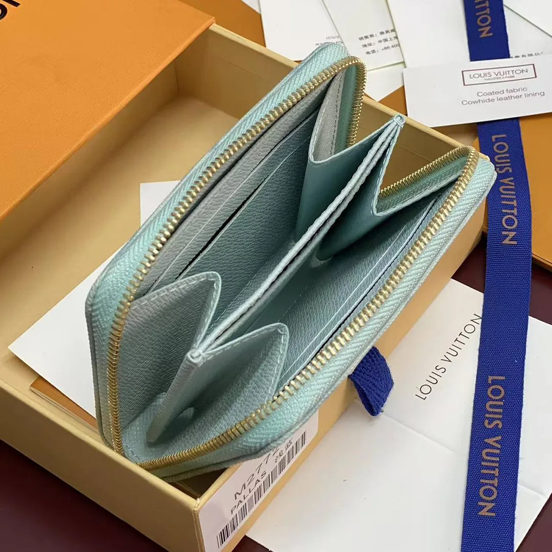 M27721 Zippy Coin Purse Monogram Origine Bleu Courrier Coated Canvas