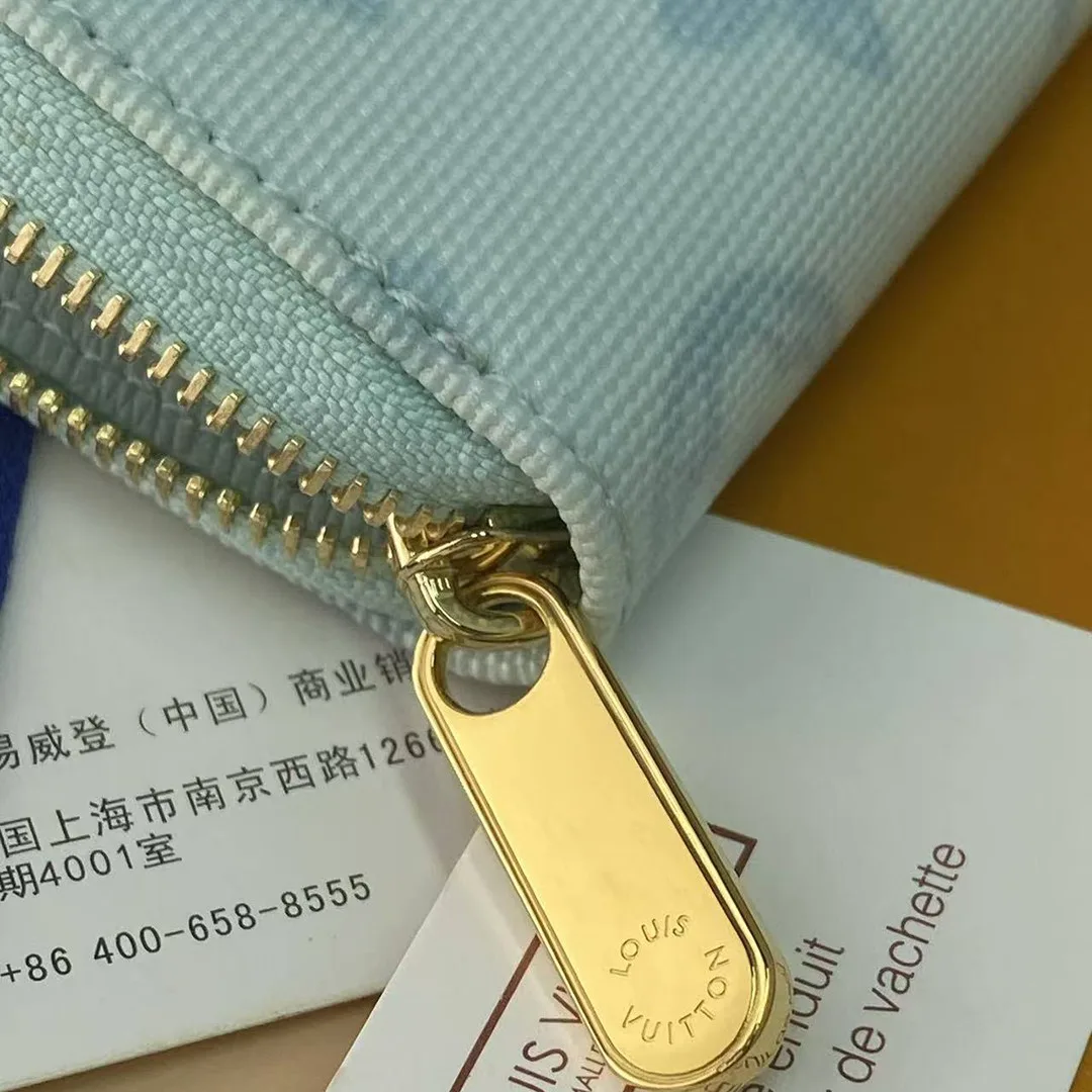 M27721 Zippy Coin Purse Monogram Origine Bleu Courrier Coated Canvas