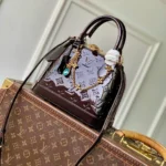 M27172 Alma BB Datewood Varnished Cowhide Leather - M27237 1 M27172 Alma BB Datewood Varnished Cowhide Leather