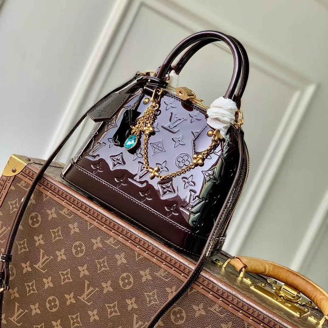 M27172 Alma BB Datewood Varnished Cowhide Leather