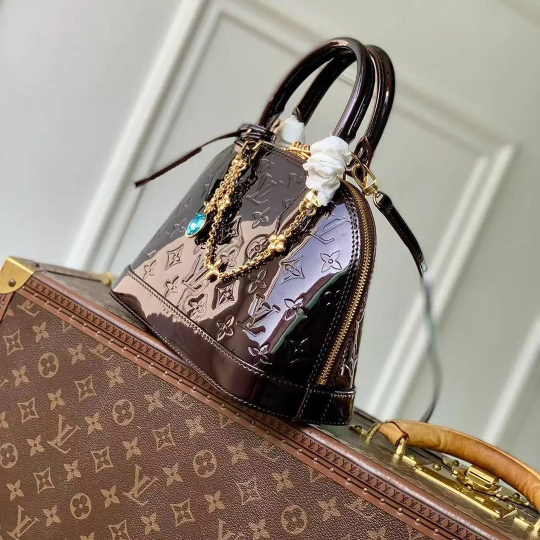 M27172 Alma BB Datewood Varnished Cowhide Leather
