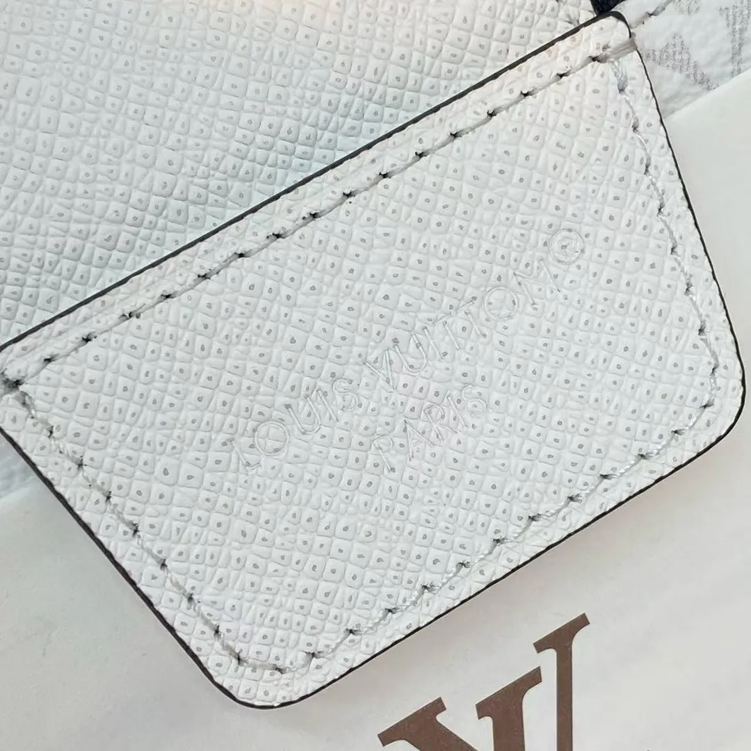 M27794 Dopp Kit Optic White Monogram Coated Canvas