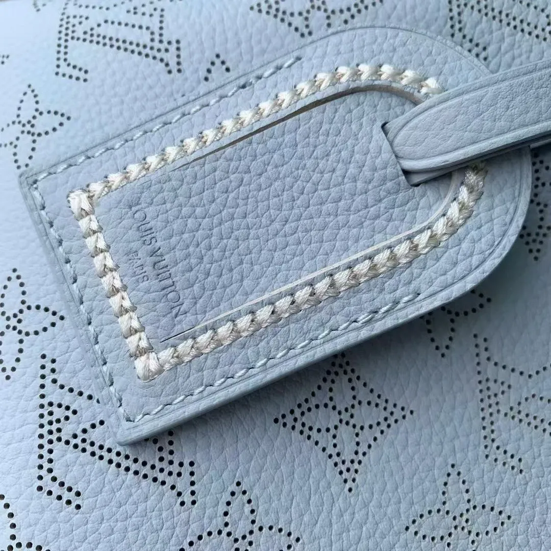 M29317 Hand It All PM Handbag Bleu Olympe Perforated Mahina Calfskin Leather With Embroidery