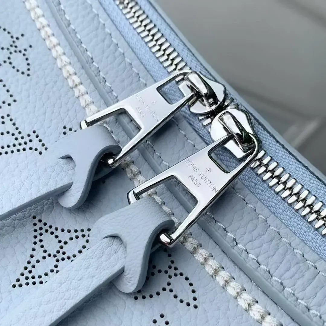M29317 Hand It All PM Handbag Bleu Olympe Perforated Mahina Calfskin Leather With Embroidery
