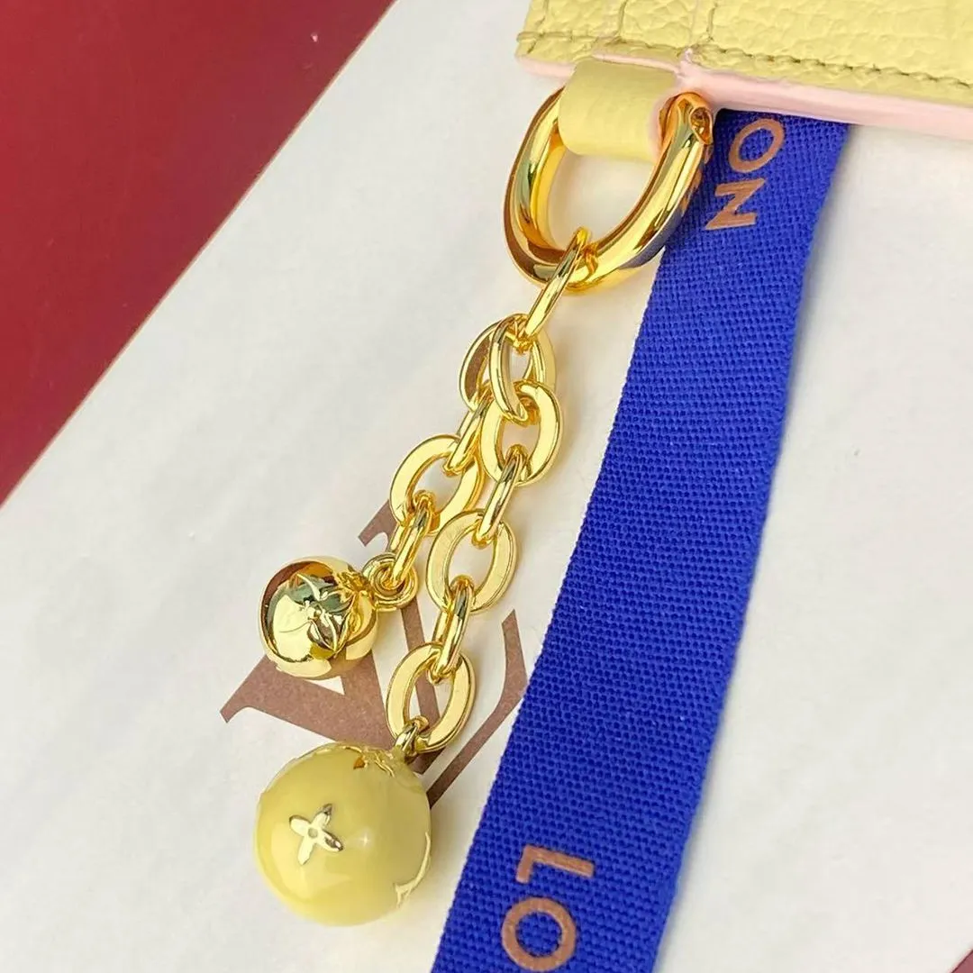 M28994 L.V Charms Card Holder Banana Monogram Empreinte Leather